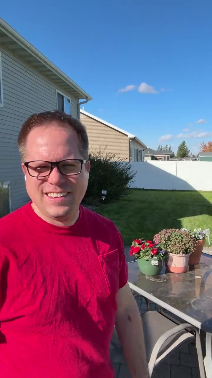Founder of The Original Barkside Bungalow standing in the fenced backyard, introducing the co-founder role